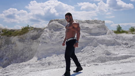 beauty and perfection of human body. muscular black african man body topless outdoor