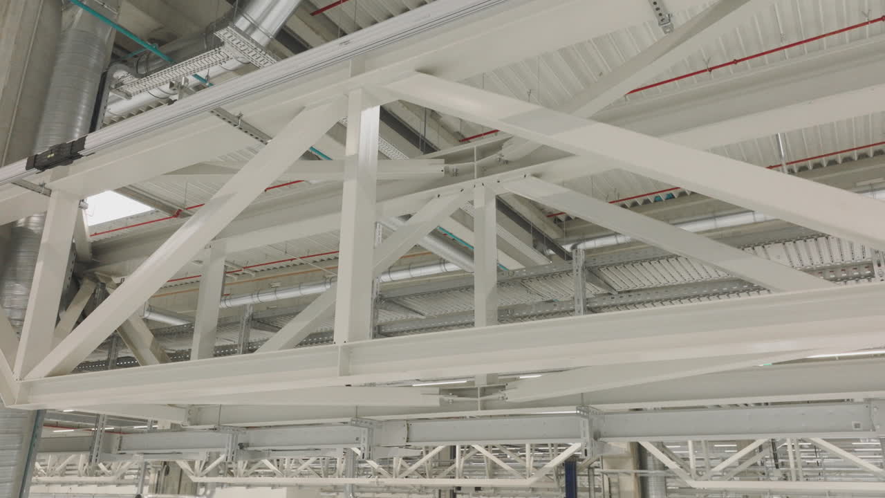 Industrial Facility Interior with Support Beams and Infrastructure