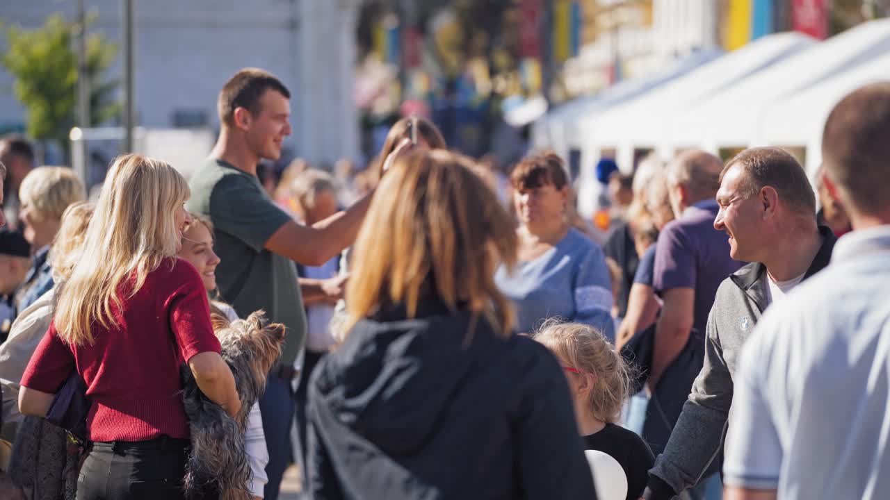 Large crowd of people. People walking in the streets of festive city
