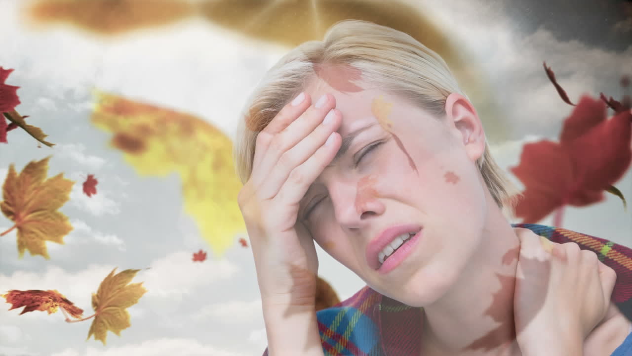 두통과 가을 잎이 떨어지는 여성 4k