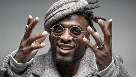 stylish musician gesturing with hands in slow motion