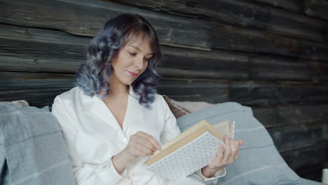 woman reading in pajamas