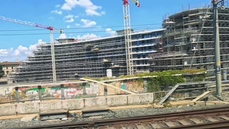 train travels through turin, showcasing urban development