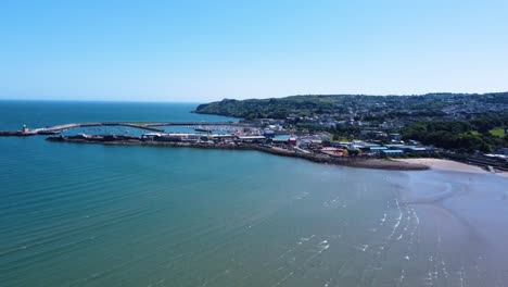 aerial orbiting shot over beautiful howth harbour in dublin, ireland