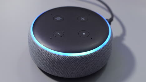 smart speaker activated by voice command control with blue light ring