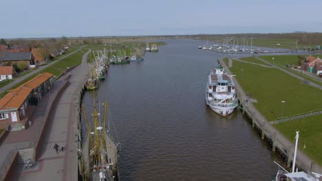 drone flight over a idyllic fishing harbor in germany