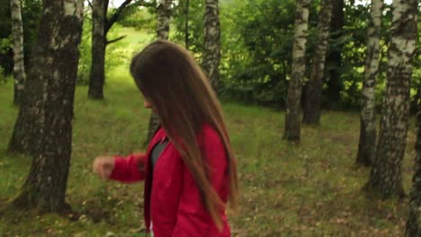 girl walking through the trees