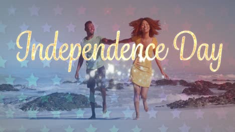 Animation-of-independence-day-text-with-american-flag-pattern-over-couple-in-love-on-beach