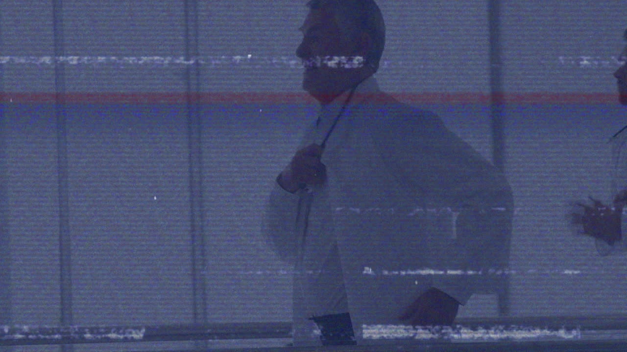 Animation of digital technical glitch over male caucasian doctors running towards operating room