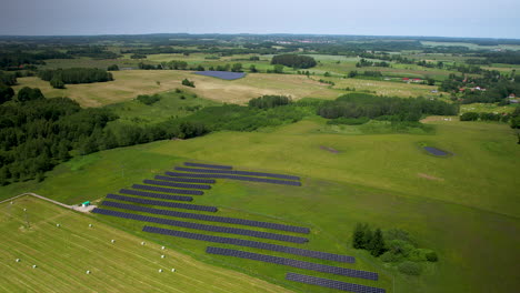 solar panel farms on agricultural fields in countryside on summer days