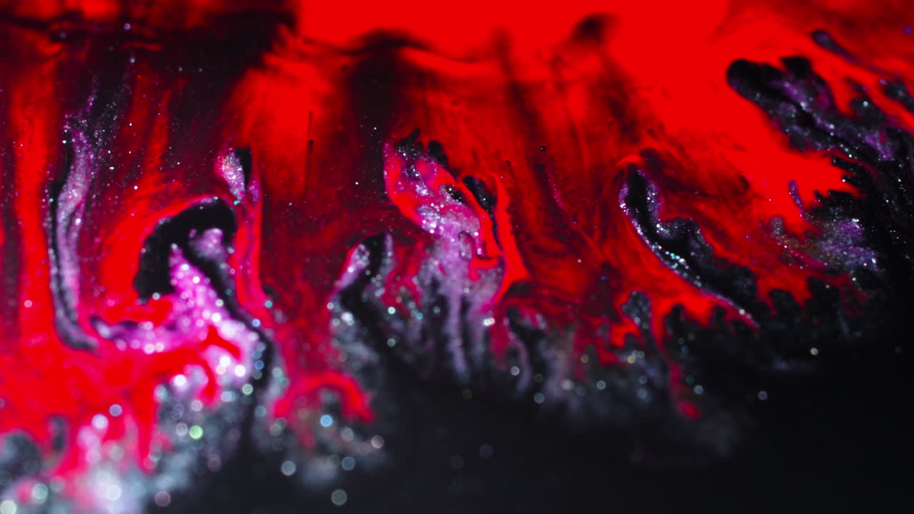 Macro shot of colorful substances swirling together artistically