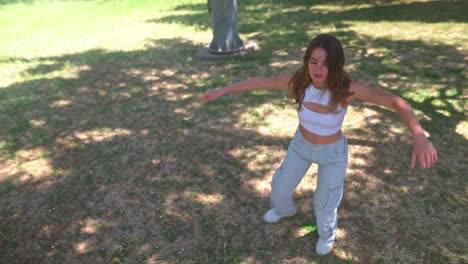 woman dancing in a park
