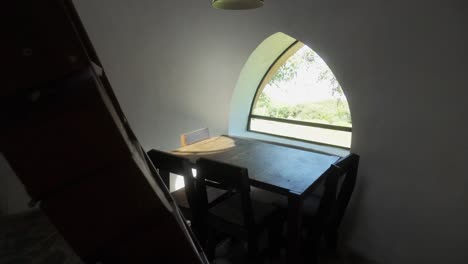 peaceful room with arch window and view