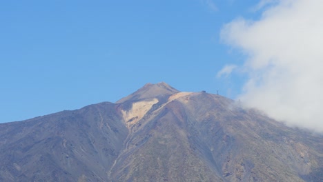 Timelapse,-white-fluffy-clouds-revealing-Mount-Teide,-volcano-in-Tenerife