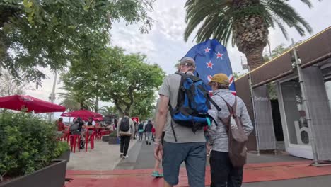 new zealand fans walking through city street