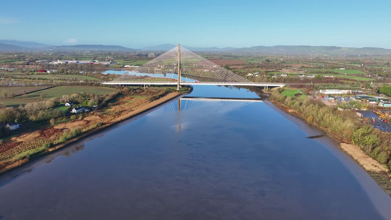 Ireland Epic Locations drone rising on the river Suir to Reveal the impressive structure of Thomas Francis Meagher Bridge connecting Waterford To Kilkenny
