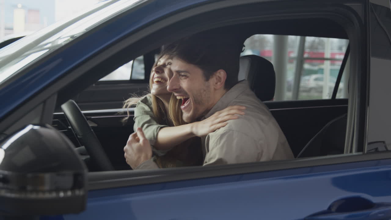 Happy Couple Excited About New Car