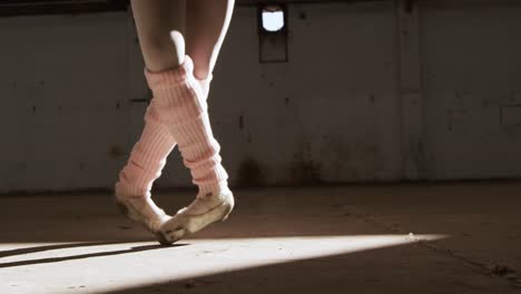 female dancer in an empty warehouse