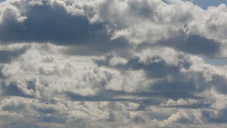 Timelapse-fast-moving-white-fluffy-clouds-blue-sky-beautiful-day