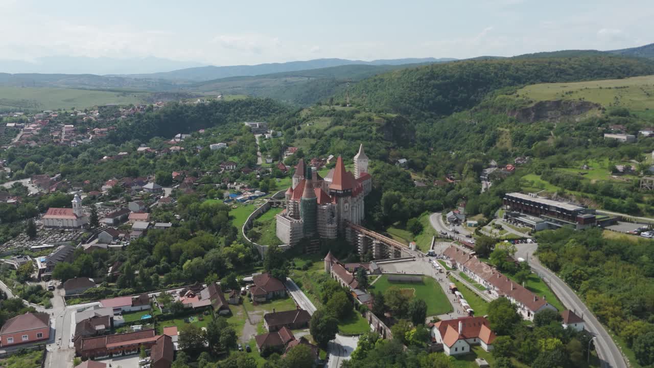 Scenic drone shot of the historic Corvin Castle and its natural surroundings