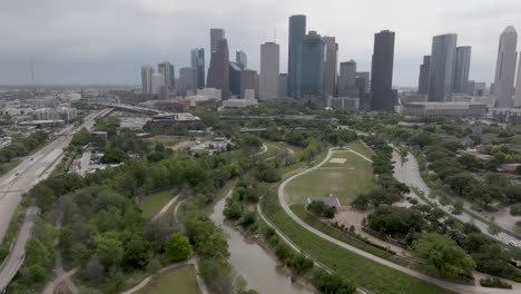 houston, texas skyline during the day with drone video moving forward and curving in