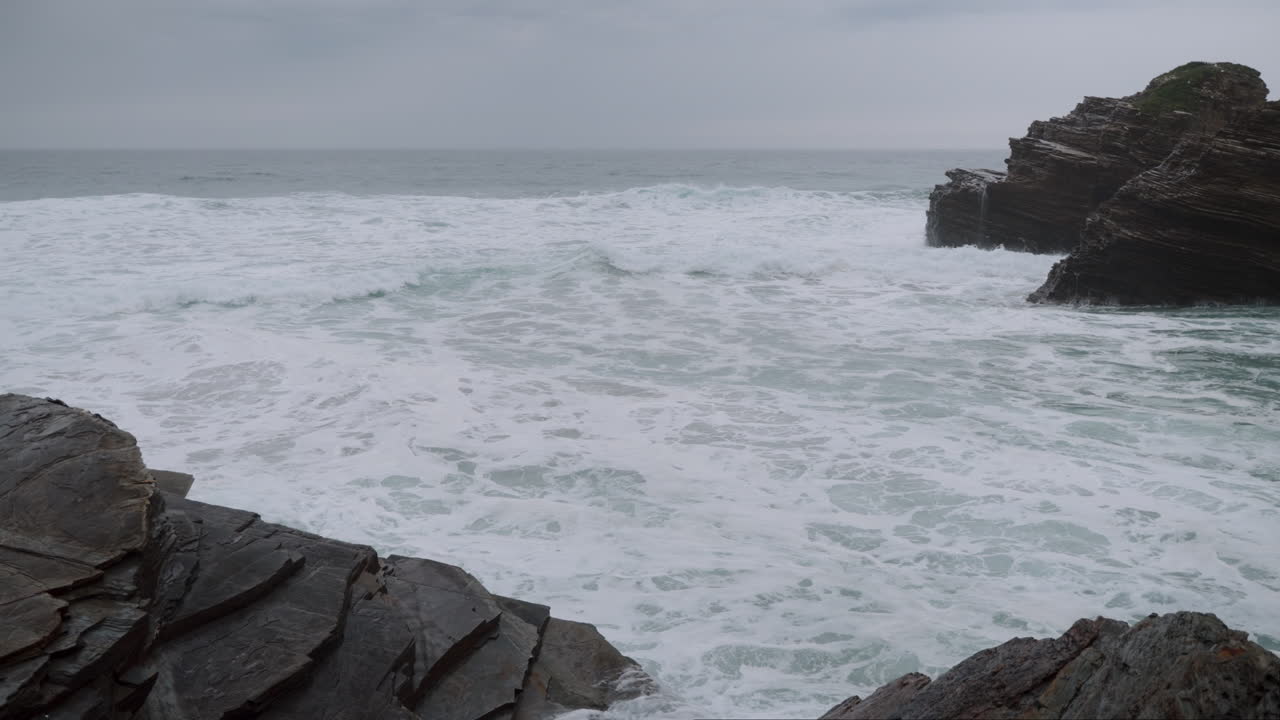 Choppy Sea and Rocky Cliffs on an Overcast Day