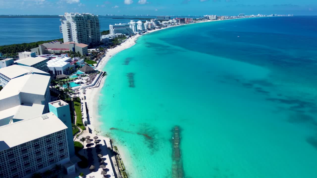 Drone aerial landscape of hotel resort pool buildings along sandy beach bay coastline in Cancun Mexico Caribbean Sea nature outdoors travel holidays snorkeling