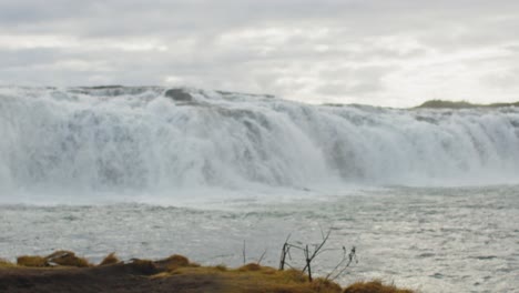 stunning slow motion view of a scenic waterfall in south iceland