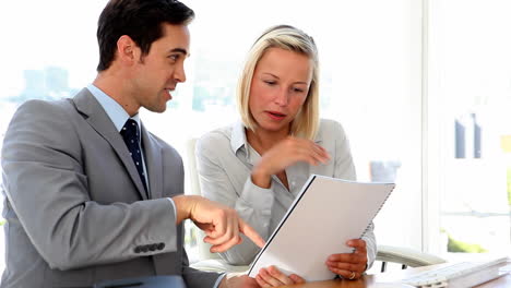 Business-colleagues-discussing-paperwork