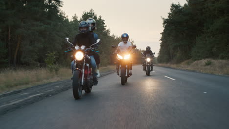 Bikers-ride-on-the-road-among-the-pine-forest-1