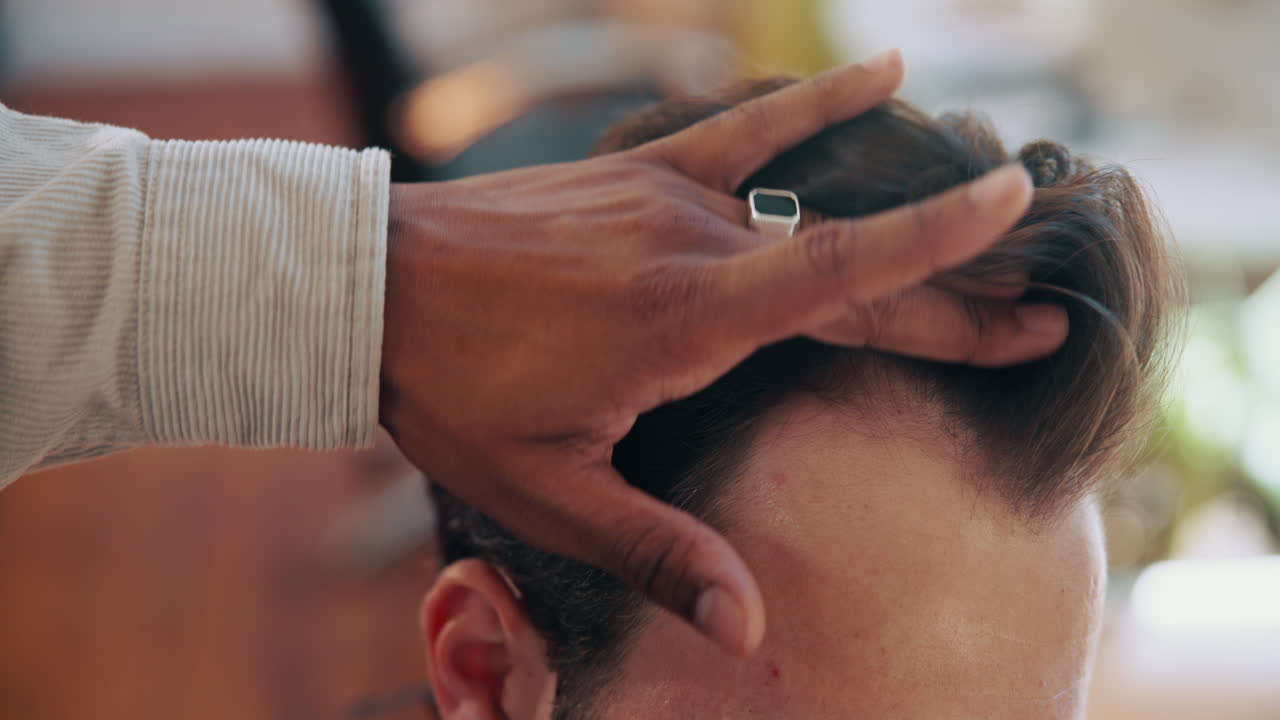 Close-up of Barber Styling Man's Hair in a Salon