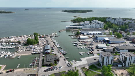 aerial tracking shot of the lauttasaari marina, in sunny, summer day in helsinki