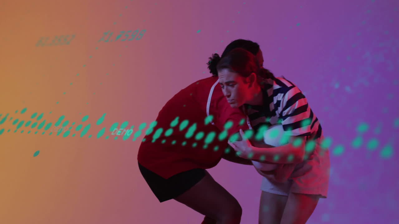 Two female rugby players competing in studio lit with gradient hues, showing teal digital overlays