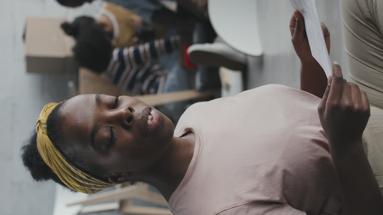 Portrait of a woman holding papers