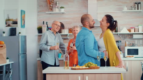 mature couple hugging flirting in kitchen