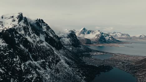 rocky mountain ridge against overcast sky in lofoten, norway. aerial shot
