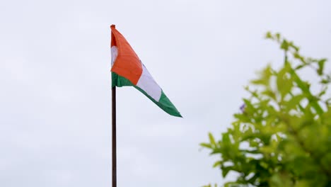 waving indian tricolor flag against white sky background at morning