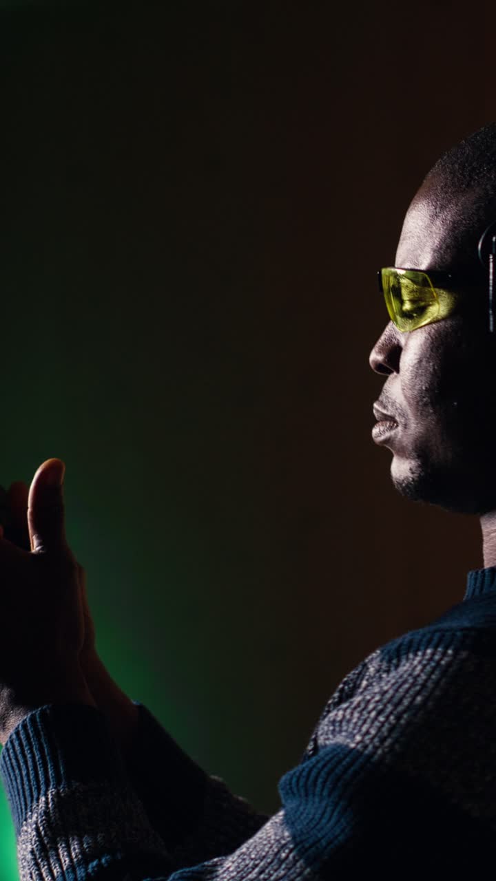 Vertical video Man reloading gun during firearm practice, pointing weapon