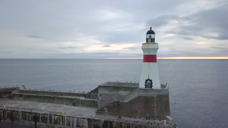 aerial view of fraserburgh harbour entrance beacon at sunrise, aberdeenshire, scotland