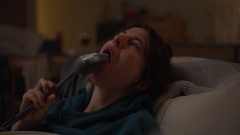 woman relaxing at home and eating