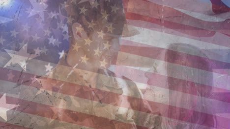 Animation-of-smiling-male-soldiers-with-wife-over-american-flag