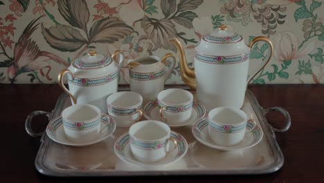 elegant tea set with intricate patterns on a silver tray