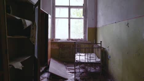 Damaged-Kindergarten-Hallway-In-Pripyat,-Ukraine-Left-During-The-Historic-Chernobyl-Nuclear-Accident---Medium-shot