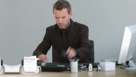 businessman working on his desk with a phone