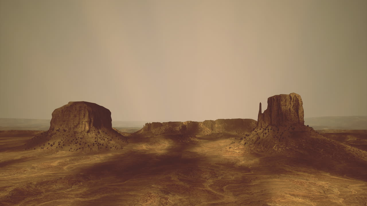 Il crepuscolo nella Monument Valley mette in risalto le sue iconiche formazioni rocciose.