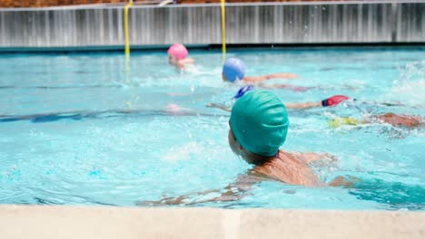 students swimming in the pool