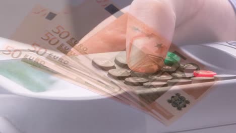 animation of euro banknotes falling over hand of caucasian man holding payment terminal