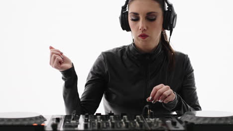 woman dj mixing music in studio