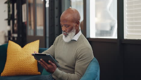 Tablet,-technology-and-senior-black-man-on-sofa