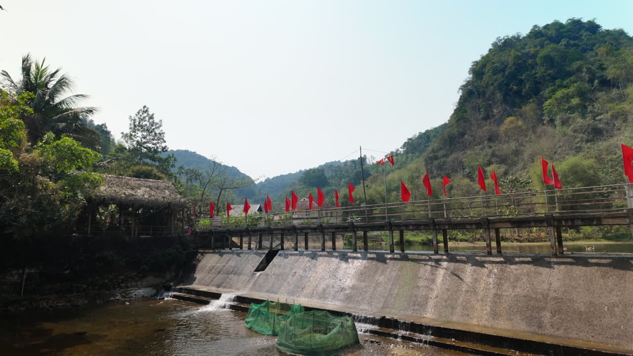 Wooden Bridge With Vietnam Red Flags In Pu Luong, Thanh Hoa Province Of Vietnam. Static Shot